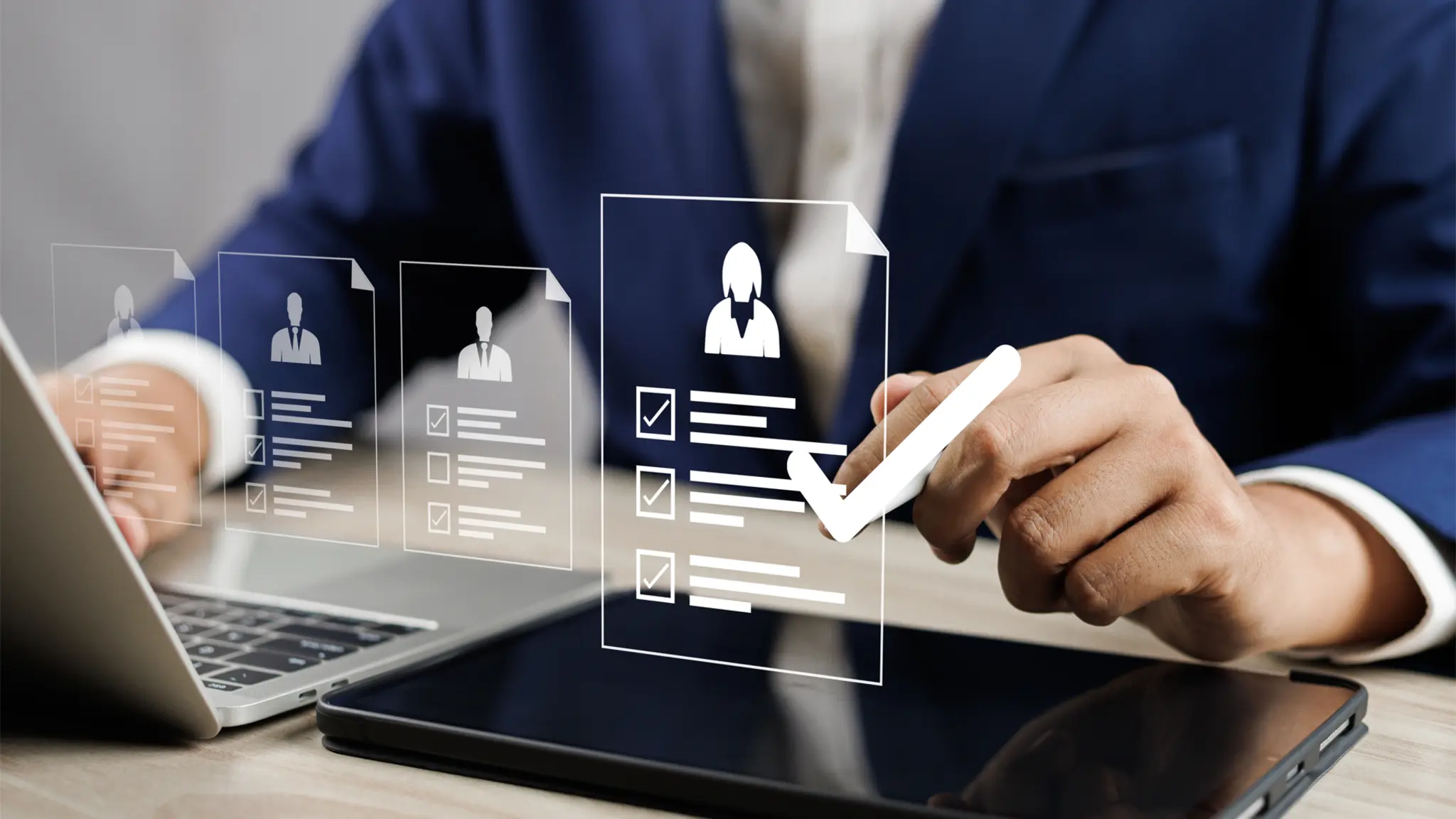 Business school professional in a suit using a laptop to examine a job application form, showcasing a serious and attentive expression.