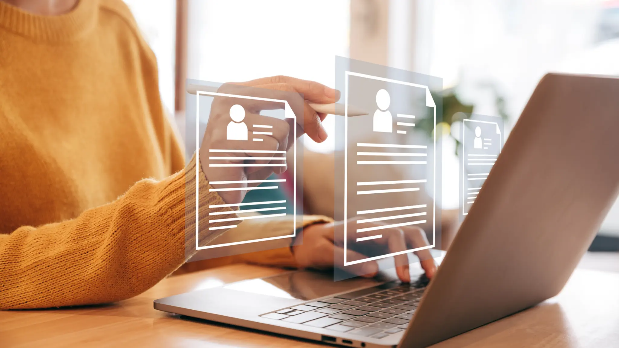 A person using a CV builder on a laptop to create a job application, showcasing a user-friendly interface.