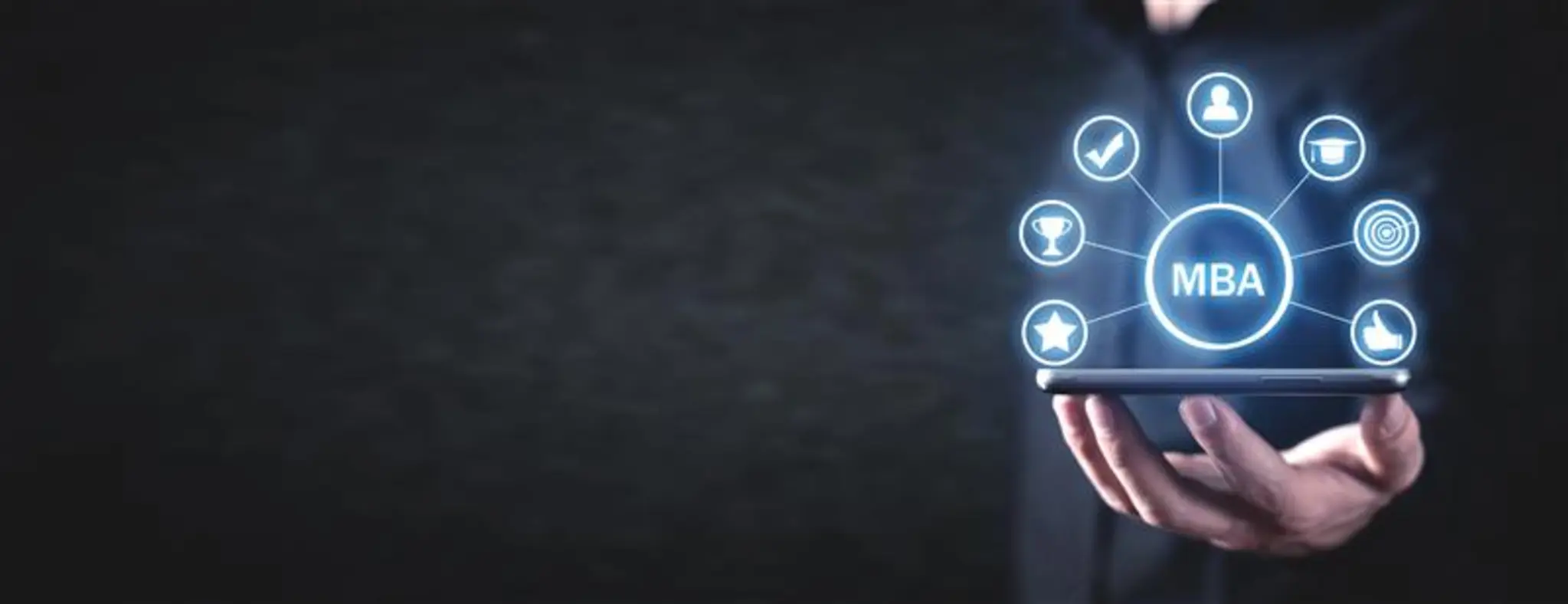 Businessman holding a tablet displaying an MBA icon, symbolising education and professional advancement in business.