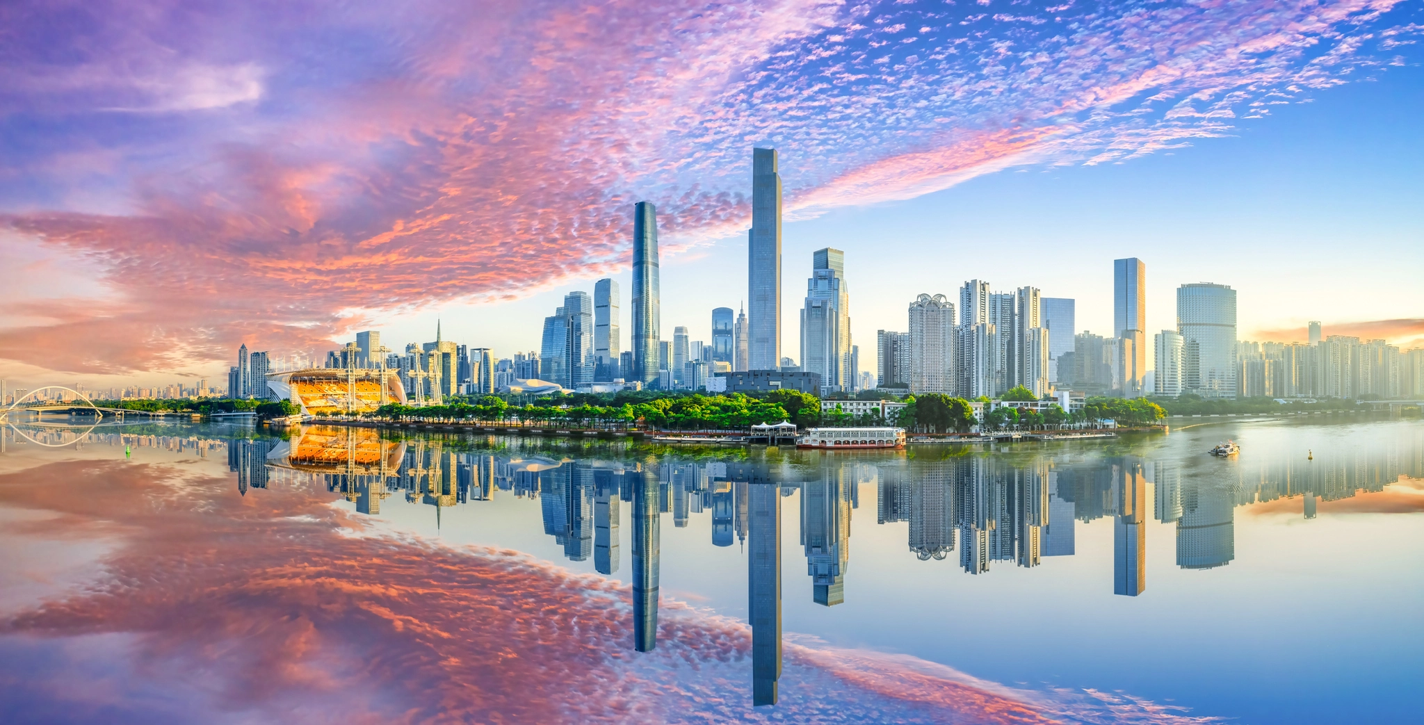 City skyline reflecting in water.