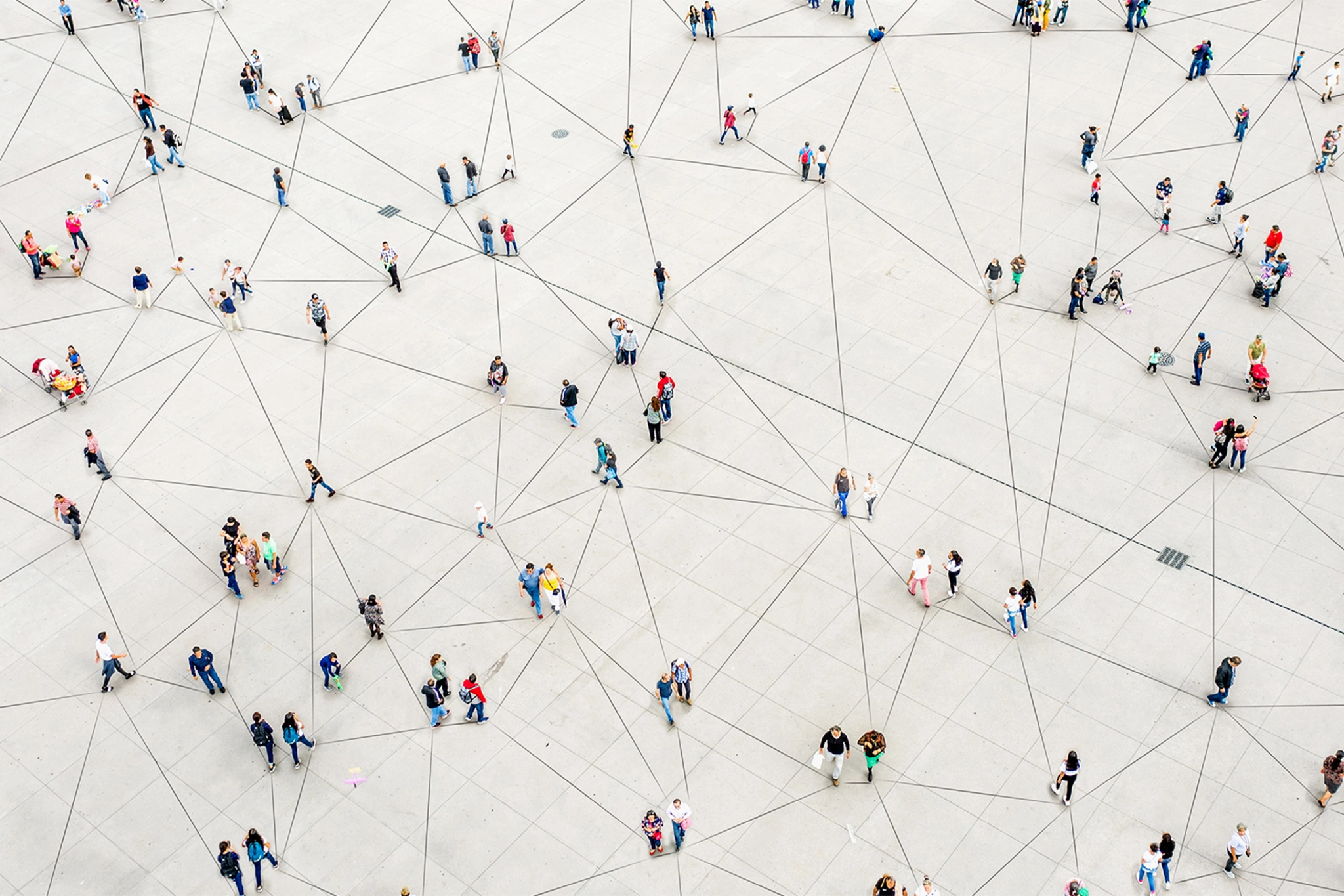 A group of people in a courtyard networking
